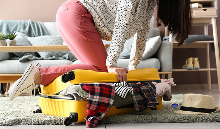 woman packing luggage